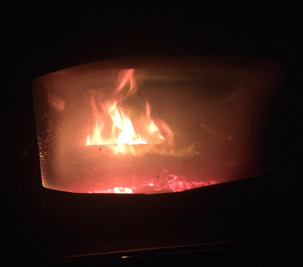 Fire burning in the wood stove.